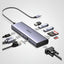 A silver and black 3-in-1 USB-C hub by UGREEN, shown with various connected and attached accessories including a USB-C cable, HDMI cable, USB flash drives, SD cards, and a VGA adapter on a white background.