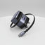 A Ugreen UK wall charger adapter with a USB-C to USB-C cable, featuring a dark gray and black design with a purple accent on the USB-A port.