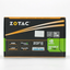 Zotac GeForce GT 750 4GB GDDR5 graphics card retail box, featuring a black and orange design with green accents and various feature badges.