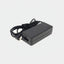 A black 35W laptop power adapter with a coiled black cable secured by a black velcro strap, shown on a plain white background.