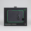 A boxed Razer Goliathus Chroma gaming mouse pad and mouse displayed on a black rolling stand inside a retail store. The box shows a dark mouse pad with green lighting and a black gaming mouse, with Razer branding visible.