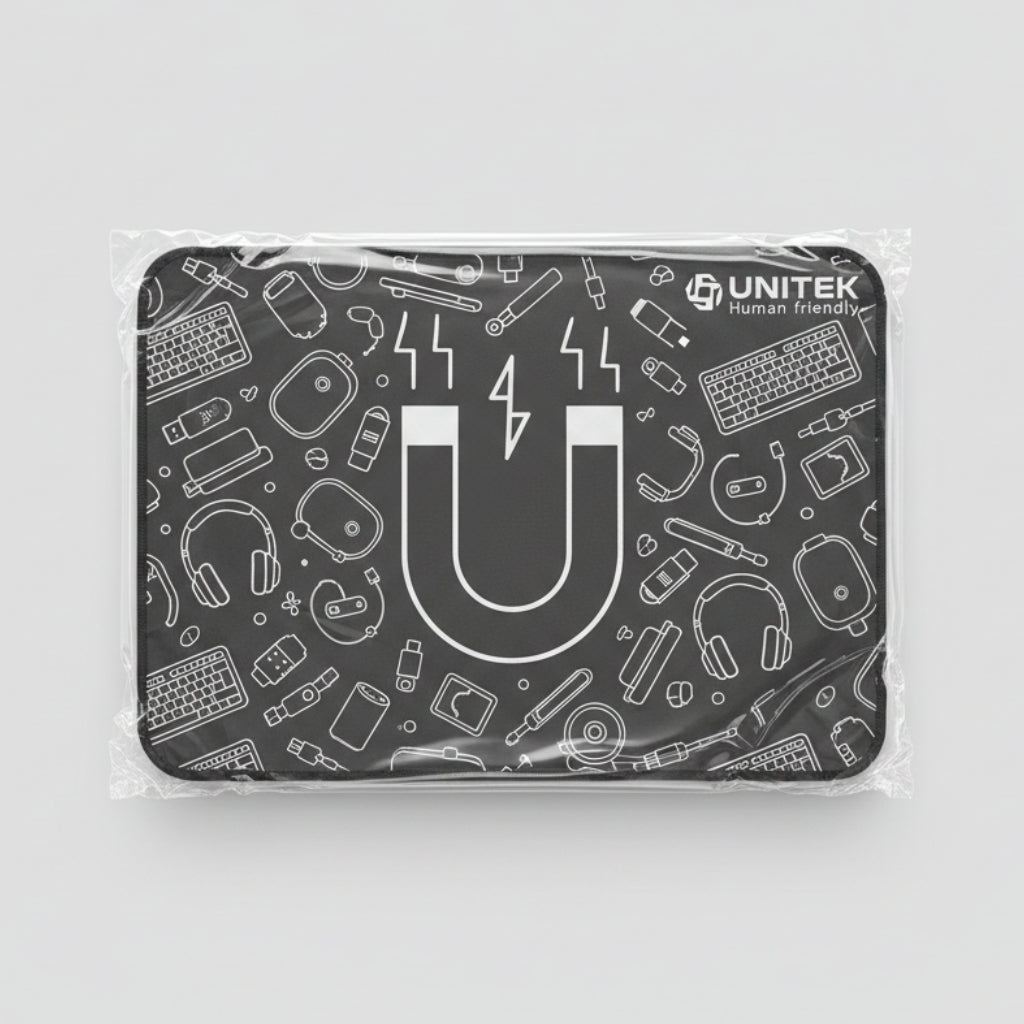 A black rectangular gaming mouse pad with white line-art graphics and the 'UNITEK' brand logo, still wrapped in protective plastic, placed on a light wood grain surface. الصورة الرئيسية