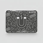 A black rectangular gaming mouse pad with white line-art graphics and the 'UNITEK' brand logo, still wrapped in protective plastic, placed on a light wood grain surface.
