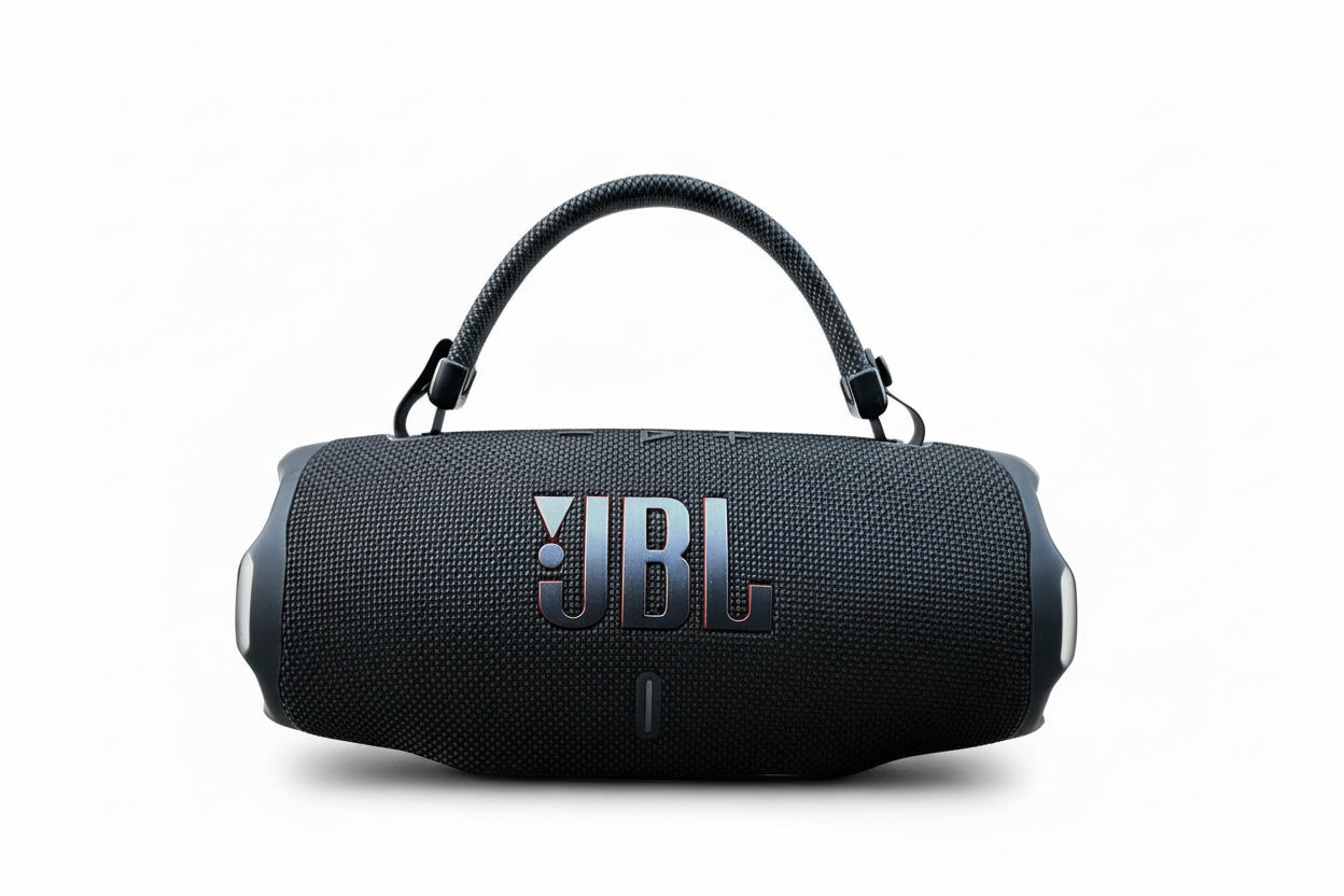 JBL Charge 6 Bluetooth speaker on grass with a Pikachu toy in the background Main image