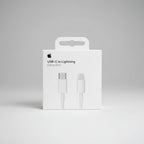 Apple USB-C to Lightning cable packaging with sunset background