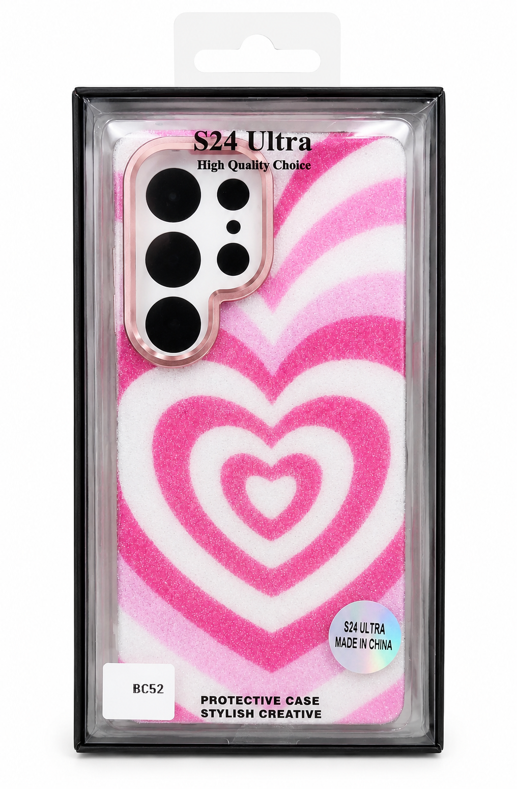 A pink and white heart-patterned protective phone case in its retail packaging, featuring a spiral heart design and a camera cutout.