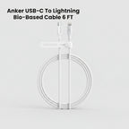 White Anker USB-C to Lightning bio-based cable 6 feet long, coiled with a white loop clip, on a white background with black text overlay at the top.