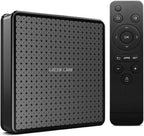 A black smart TV box with a geometric patterned front and the words GREEN LION printed on it, shown next to a matching black remote control on a white background.