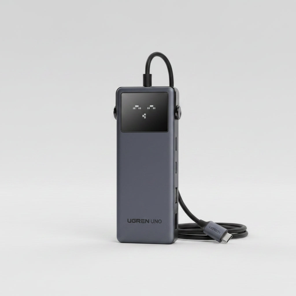 UGREEN Uno 6-in-1 USB C hub shown in a dark gray metallic finish, featuring multiple ports and a central USB-C port, set against a dark blue and purple gradient background with text callouts.