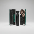 A boxed electric beard trimmer shown in its retail packaging, with the front and back of the box visible. The product itself is black, and the packaging is black with teal accents.