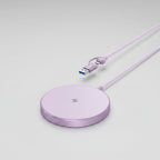 A light purple wireless charging pad with a matching braided USB-C cable, shown on a clean white background.