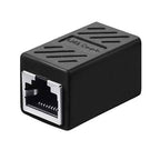 A black RJ45 network adapter or cable coupler with a silver metal connector face, shown on a plain white background.