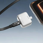 White adapter with black cable connected to a smartphone on a gradient blue background