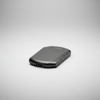 A black and dark gray portable external hard drive with a matte finish, featuring a USB port on one end and a brand logo on the other, shown on a plain white background.