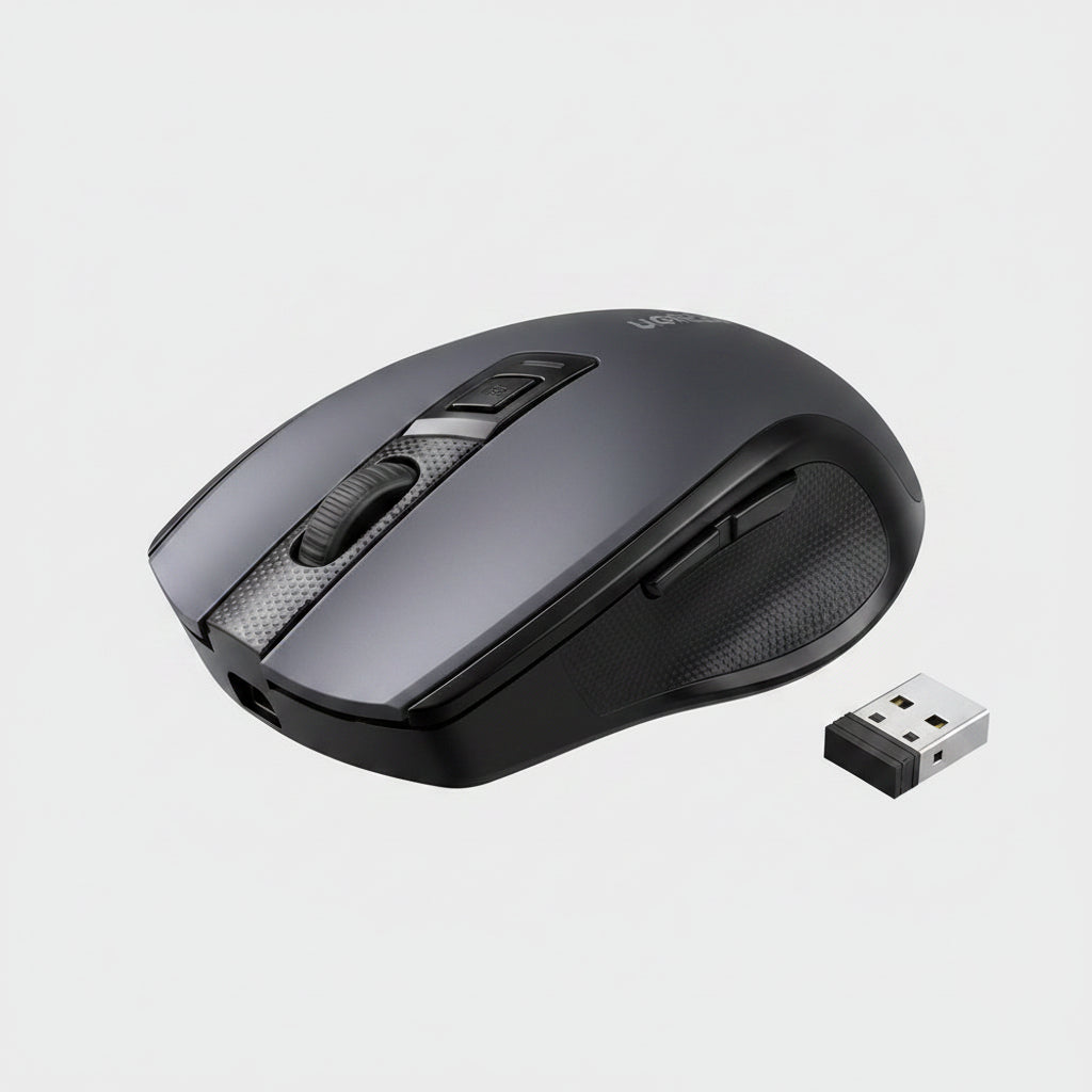 A dark gray wireless computer mouse with a vertical scroll wheel and a small USB receiver icon in the bottom right corner, on a plain white background. الصورة الرئيسية