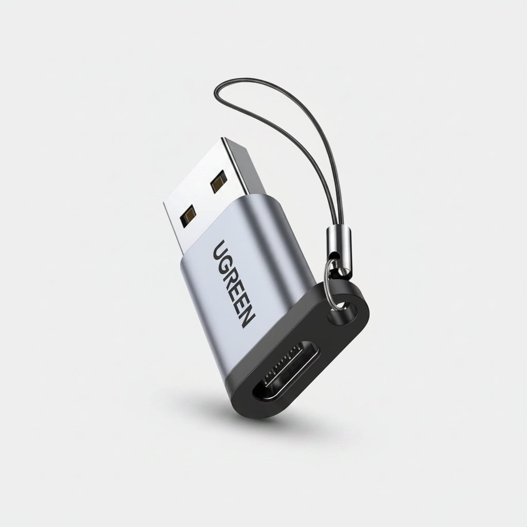 UGREEN USB flash drive adapter with a silver aluminum body, black connector base, and a black lanyard keychain, shown on a plain white background.