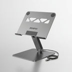A silver metallic laptop stand with black rubber feet, shown on a light gray background with callout text highlighting features like metal hinge durability, rubber design, and ergonomic support. The brand name BENFEI is visible on the center of the stand.