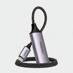 UGREEN USB-C to HDMI adapter cable with a metallic silver and black cylindrical body, braided black cable, and USB-C connector, shown on a white background.